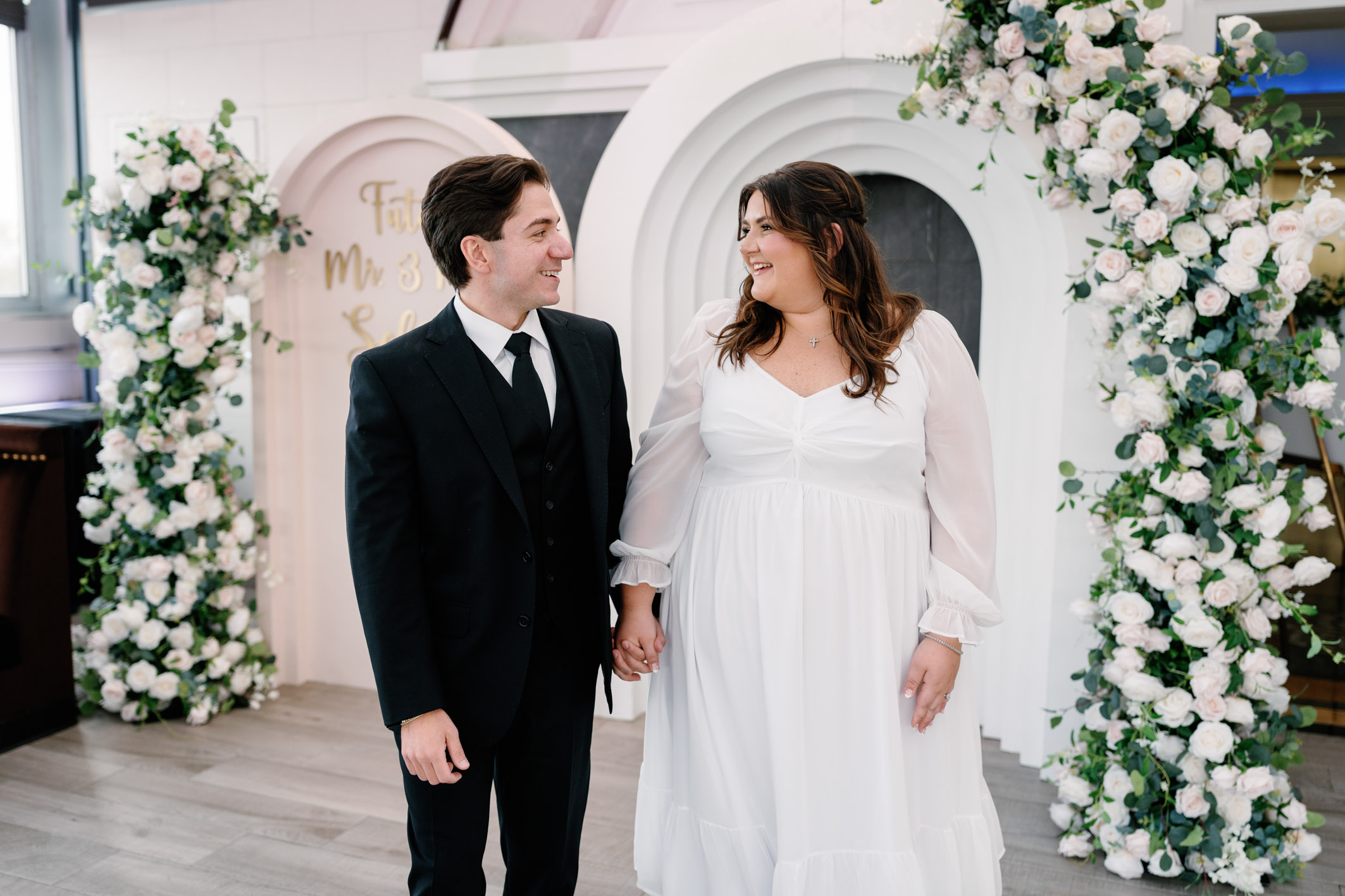 bride and groom-to-be walking in their venue