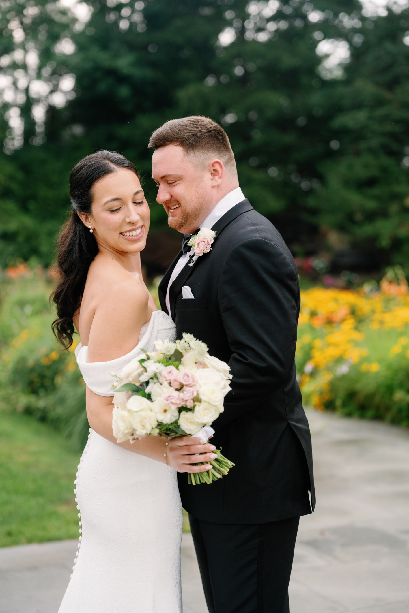 bride and groom cuddled together before their wedding